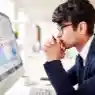 Operational risk management professionals reviewing business risk reports during a corporate strategy meeting online