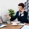 Professional employee using phone etiquette skills during a business call in a modern office environment